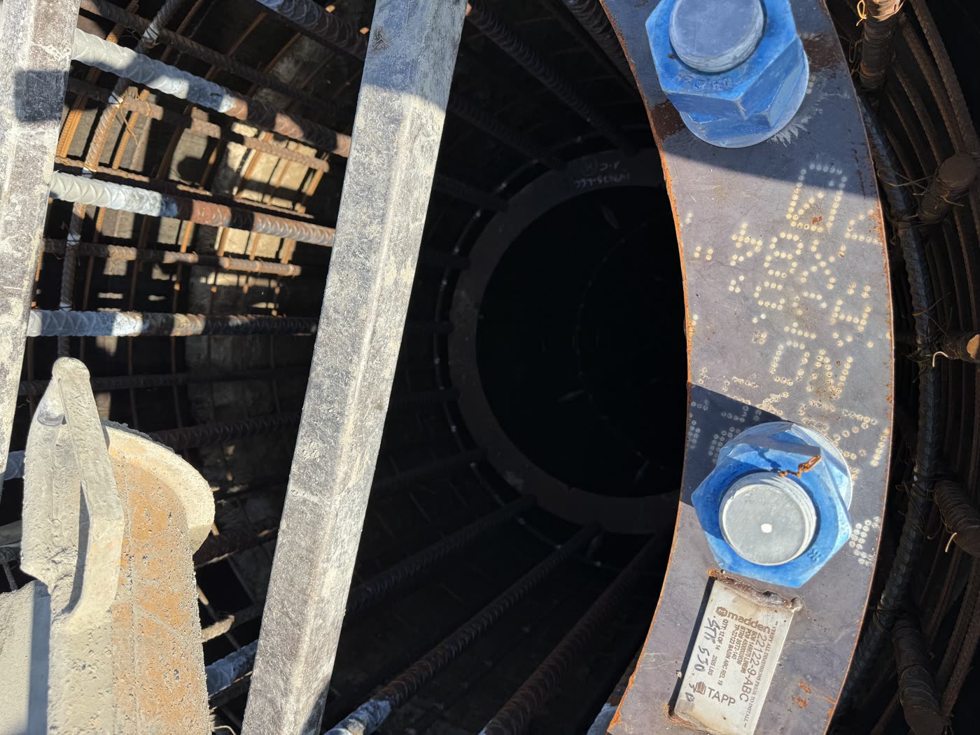 Looking down a drilled shaft through the anchor-bolt template